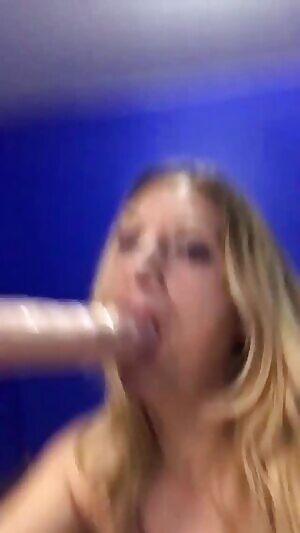 She puts the whole dildo in her mouth