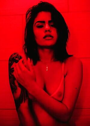 An evil-looking girl in red