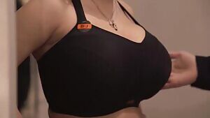 Stacy Vandenberg trying on a bra