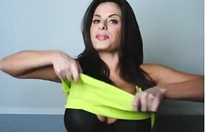 Wendy in a yellow tank top and black bra