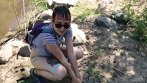 Girl Peeing in the River